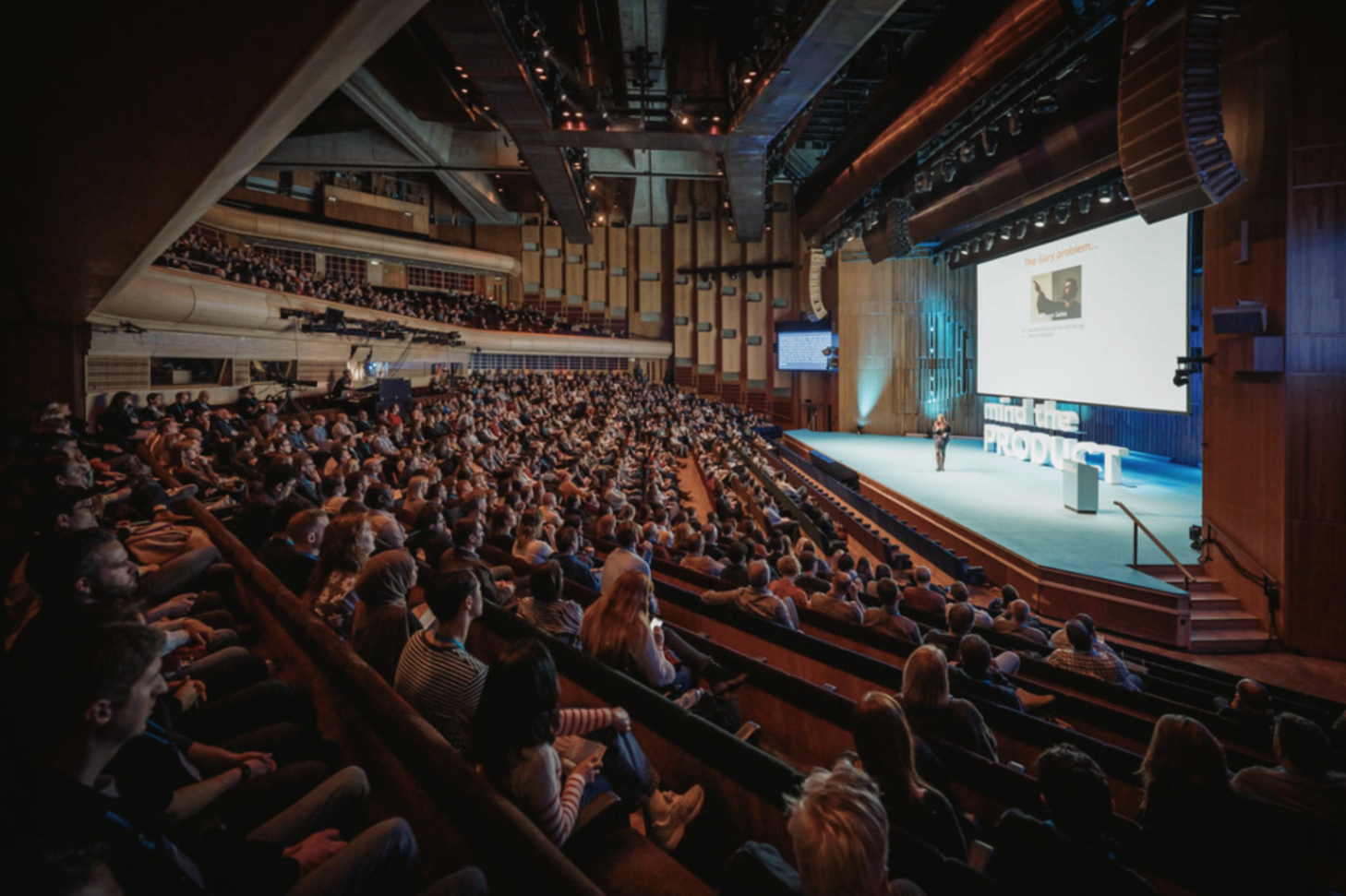 Large Mind the Product conference audience in a theater