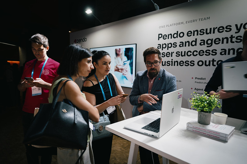 Attendees at the Pendo sponsor booth